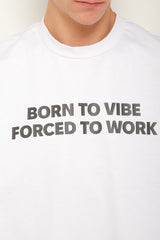 White oversized t-shirt "Born to vibe, Forced to work"