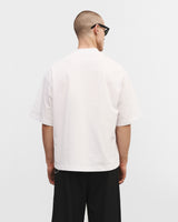 White oversized t-shirt "Bad choices, good stories"