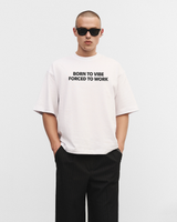 White oversized t-shirt "Born to vibe, Forced to work"